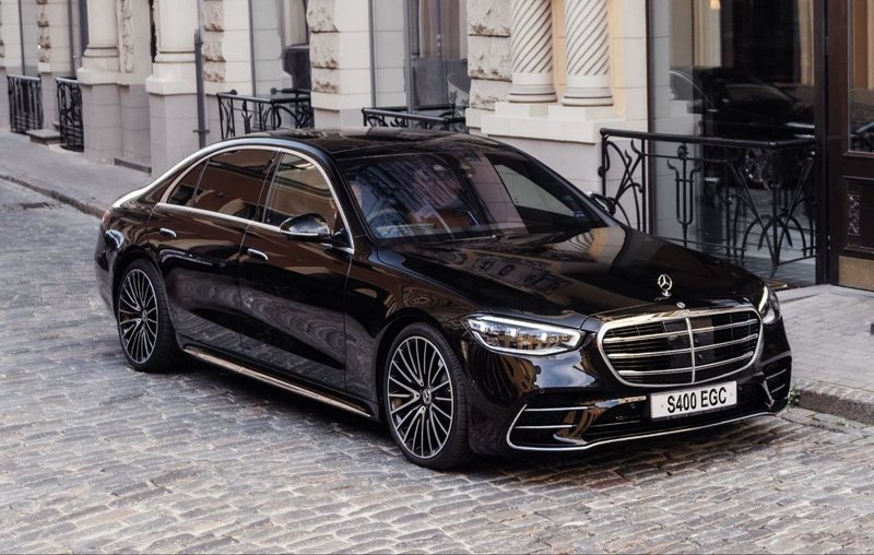 Mercedes-Benz S-Class chauffeur car on a cobbled street — private executive transport, Travel in Style Essex