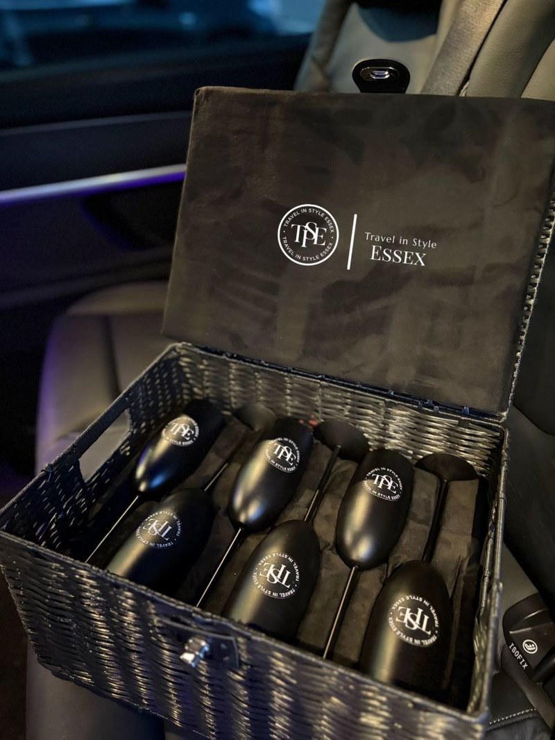 TISE bespoke wicker hamper with engraved champagne flutes — luxury chauffeur amenity